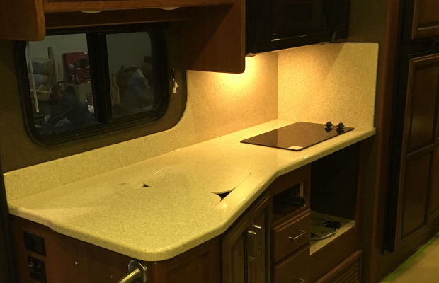 Durable solid surfaces with utility for recreation vehicles.